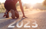 Fototapeta Kawa jest smaczna - Runners take off. The readiness of leaders, vision and new ideas are beginning in 2023. Concept of Stepping into the new world and Adopt for Success in 2023 for new life. Starting to new year. 2023. 