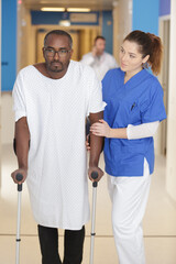 Wall Mural - doctor is helping the patient with crutches