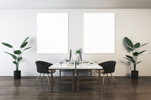 Front View On Two Blank White Posters On Light Wall Background In Stylish Coworking Office Room With Modern Computers On Light Tables, Green Flowers On Dark Wooden Floor. 3D Rendering, Mock Up