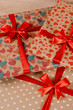 © Rabizo Anatolii - Romantic valentine day gift box for couple in love with heart ornament and red bow and silk ribbon.