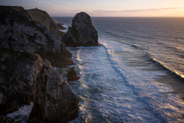 Poster - View of rocks and ocean surf during sunset near Cape Roca. Sintra, Portugal.