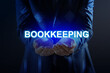 © New Africa - Bookkeeping concept. Businessman holding word on dark blue background, closeup