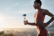 Black woman, water bottle or earphones in running workout goals, healthcare wellness training or sunset city exercise. Fitness drink, sports athlete or runner listening to motivation radio at sunrise