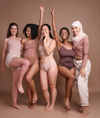 Beauty, diversity and group of women in studio for wellness, fashion and body positivity on brown background. Self care, support and females celebrate natural skincare, self love and healthy skin