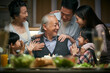 © imtmphoto - three generation asian family celebrating grandpa's birthday at home