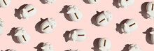 Banner White Piggy Banks On Pink Background. Financial And Money Saving Pattern Concept