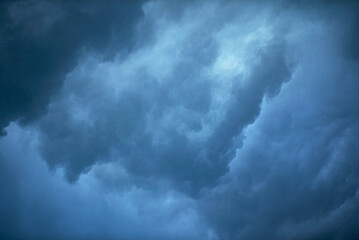 Wall Mural - dramatic dark blue sky with heavy clouds background