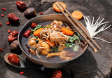 Fototapeta Desenie - Bak kut teh, traditional chinese herbal pork ribs soup on white background. Top view