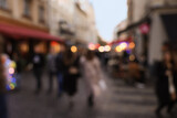 Fototapeta Miasto - Blurred view of people walking on city street