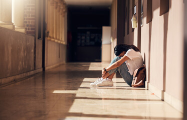 sad, lonely and girl with depression at school, crying and anxiety after bullying. mental health, ti