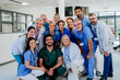 © Halfpoint - Portrait of happy doctors, nurses and other medical staff in hospital.
