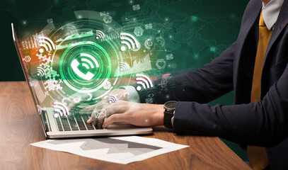 Business hand typing on a modern laptop