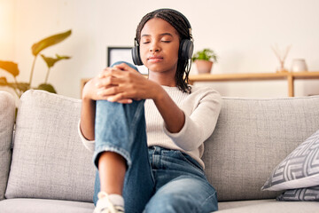 Canvas Print - Music headphones, peace and relax girl listening to wellness podcast for calm mindset, mindfulness or audio meditation. Easy meditating, living room sofa or gen z black woman streaming zen radio song