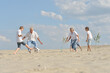 © aletia2011 - Family playing football on a beach in summer day