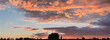 Panorama of sky with cumulus and stratocumulus clouds at sunset