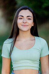 Wall Mural - Brunette young beautiful teenager girl outside enjoying a beautiful day