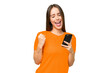 Young pretty caucasian woman over isolated background with phone in victory position