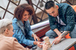 © zinkevych - Three young adults playing a board game