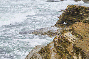 Wall Mural - waves crashing on rocks