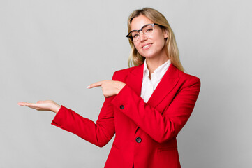 Wall Mural - pretty caucasian blonde businesswoman with red blazer