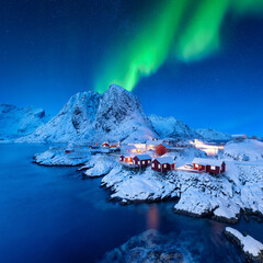 Wall Mural - aurora borealis. northern lights. view on the house in the hamnoy village, lofoten islands, norway. 