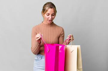 Wall Mural - pretty caucasian woman with shopping bags