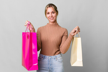 Wall Mural - pretty caucasian woman with shopping bags