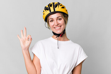 Wall Mural - pretty caucasian woman with a bycicle helmet