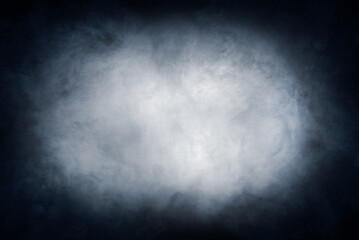 Abstract smoke texture over black. Fog in the darkness.