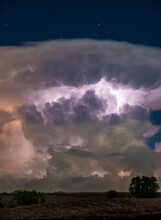 Lightning Illuminates A Large Cumulus Cloud.