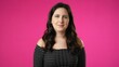 © Robert Peak - Smiling attractive brunette young woman 20s 30s years old posing isolated on pink background studio. People sincere emotions lifestyle concept. Looking at camera with charming smile