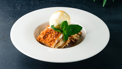 Wall Mural - Pieces of honey cake with ice cream and mint.