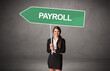© ra2 studio - Young business person in casual holding road sign