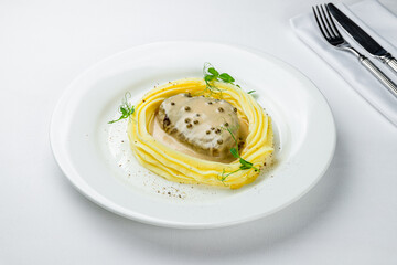 Wall Mural - steak in pepper sauce with mashed potatoes on white plate