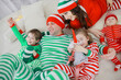 © kichigin19 - christmas pajama striped party family with kids, new year costumes, fun at home in bed