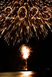 Fototapeta Kawa jest smaczna - 2023 new year coming written with sparkler and fireworks illuminationas a background