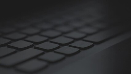 Black keyboard in a close up with a focus pull