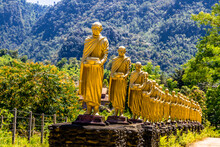 Buddha Statue Golden Of Wat Phra That Chulamanee Sri Siam, Baan Kormanae, Tambon Tha Song Yang Tak Province Thailand With Mountain And Green Trees Background