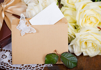 Poster - empty card form and white rose. bouquet of white rose with green leaves on a wooden