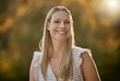 © Delcio F/peopleimages.com - Face portrait, smile and happy woman on vacation, holiday or trip outdoors. Relax, freedom and smiling female from Canada on break, having fun or enjoying quality time alone in nature, park or garden