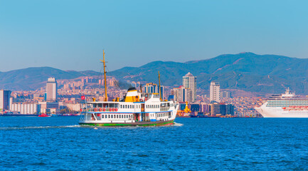 Poster - Izmir ferry service in the Gulf of Izmir - Coastal cityscape with modern buildings under blue sky - Izmir, Turkey