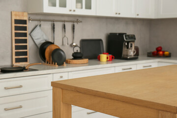 Sticker - Stylish wooden table in kitchen. Interior design