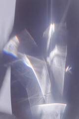 Wall Mural - sunlight background, abstract backdrop with light and shadow, glare and shine on paper texture, rain