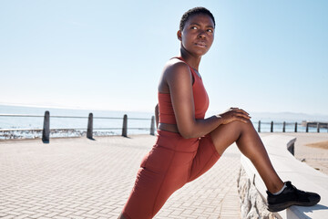 Stretching, legs and black woman on the promenade for fitness start, cardio motivation and exercise in Costa Rica. Warm up, sport and African runner training for sports competition and workout