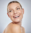 © K Davis/peopleimages.com - Face, beauty skincare and woman in studio isolated on a gray background. Thinking, cosmetics and happy female model in makeup smiling after spa facial treatment for healthy, glowing and flawless skin