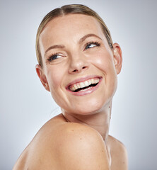 Face, beauty skincare and woman in studio isolated on a gray background. Thinking, cosmetics and happy female model in makeup smiling after spa facial treatment for healthy, glowing and flawless skin