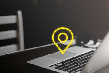 Yellow geo location icon on minimal workplace background. Abstract business concept
