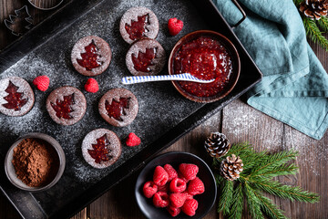 Christmas cocoa linzer cookies with raspberry jam