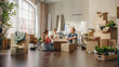 © Gorodenkoff - Happy Homeowners Moving In: Lovely Couple Sitting on the Floor of Cozy Apartment Unpacking Cardboard Boxes, Little Daughter Joins them. Cheerful Day, Harmony, Happiness, Sweet Home for Young Family