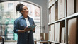© Gorodenkoff - Portrait of a Worker Checking Inventory, Writing in Tablet Computer. Black Woman Working in a Warehouse Storeroom with Rows of Shelves Full of Parcels, Packages with Orders Ready for Shipment.